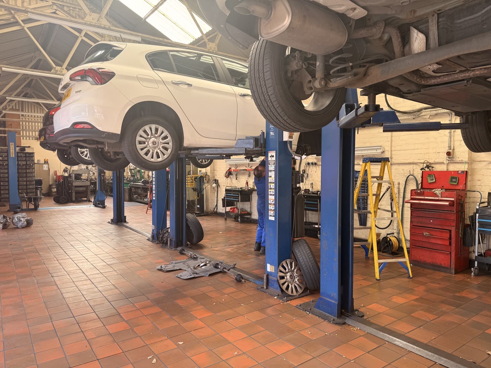 A car raised on a ramp for clutch work at Top Gear Transmissions, Liverpool